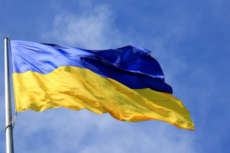 The blue and yellow Ukrainian flag fluttering in the wind